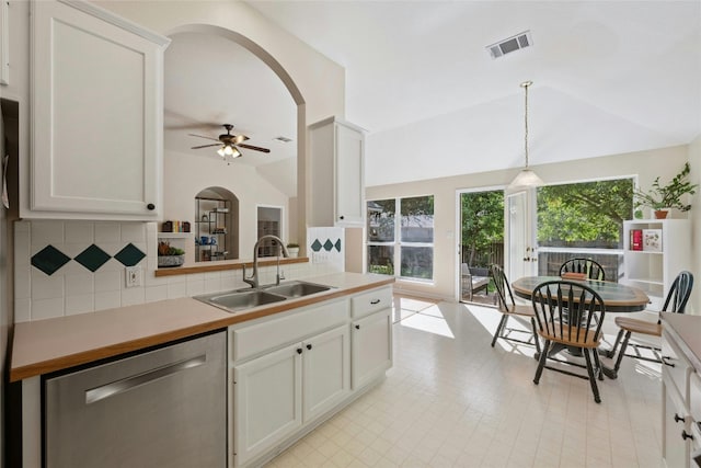 5216 Trading Bnd, Austin, TX 78735 - kitchen featuring a sink, stainless steel dishwasher, vaulted ceiling, arched walkways, and a ceiling fan