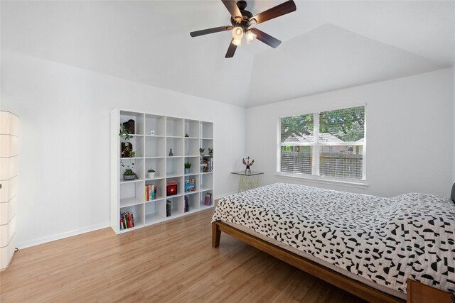 5216 Trading Bnd, Austin, TX 78735 - bedroom with wood finished floors, vaulted ceiling, baseboards, and a ceiling fan