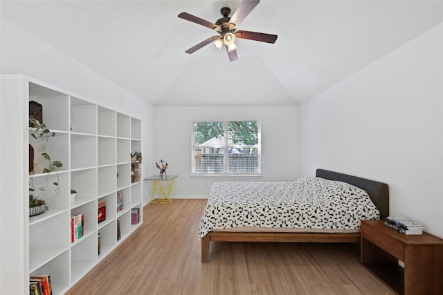 5216 Trading Bnd, Austin, TX 78735 - bedroom featuring wood finished floors, baseboards, vaulted ceiling, and a ceiling fan