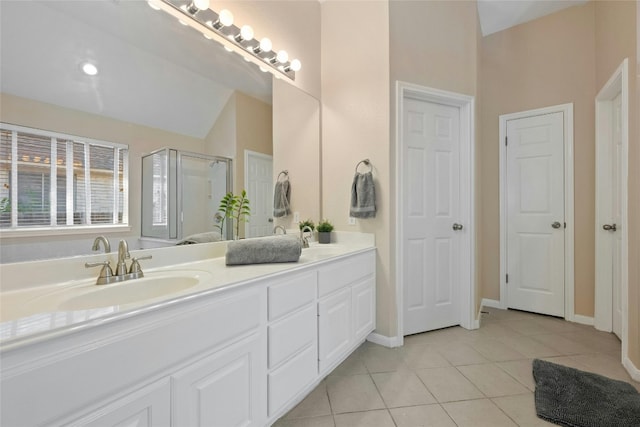 5216 Trading Bnd, Austin, TX 78735 - full bath with double vanity, tile patterned floors, a shower stall, lofted ceiling, and baseboards