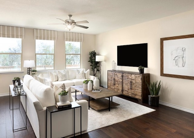 1517 Purple Martin Dr, Pflugerville, TX 78660 - living room with dark wood-style flooring, baseboards, and a ceiling fan