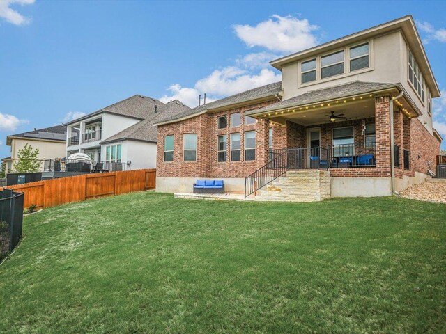 2733 Painted Sky Bnd, Leander, TX 78641 - back of property featuring a fenced backyard, a ceiling fan, brick siding, a porch, and stucco siding