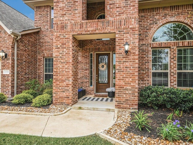2733 Painted Sky Bnd, Leander, TX 78641 - entrance to property featuring brick siding and a shingled roof