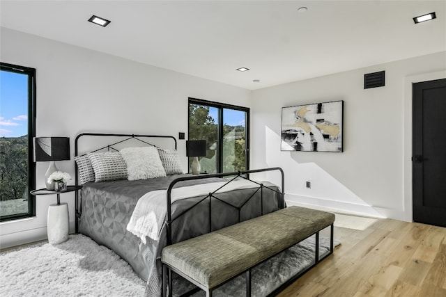 1903 Toro Canyon Rd, Austin, TX 78746 - bedroom with wood finished floors and recessed lighting