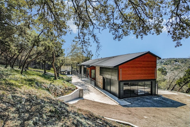 1903 Toro Canyon Rd, Austin, TX 78746 - view of property exterior with a metal roof