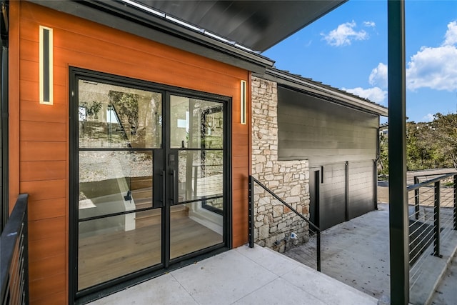 1903 Toro Canyon Rd, Austin, TX 78746 - property entrance featuring stone siding and french doors