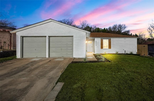 6014 London Dr, Austin, TX 78745 - ranch-style home with brick siding, concrete driveway, a front yard, and a garage