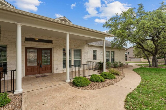 21507 Lakefront Dr, Lago Vista, TX 78645 - property entrance with french doors and a yard