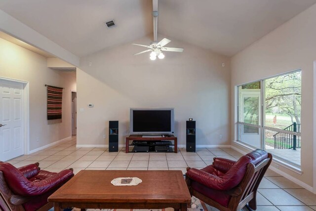 21507 Lakefront Dr, Lago Vista, TX 78645 - living room featuring light tile patterned floors, beamed ceiling, high vaulted ceiling, a ceiling fan, and baseboards