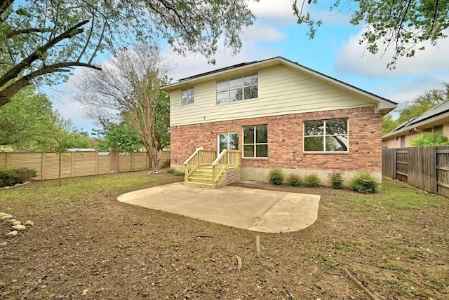 13401 Lamplight Village Ave, Austin, TX 78727 - back of property with a patio, a fenced backyard, and brick siding
