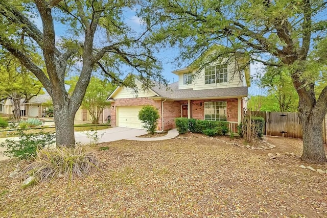 13401 Lamplight Village Ave, Austin, TX 78727 - traditional-style house featuring brick siding, an attached garage, driveway, and covered porch