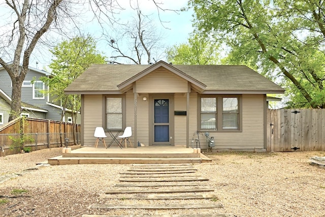 5313 Martin Ave, Austin, TX 78751 - bungalow featuring a fenced backyard, roof with shingles, and a deck