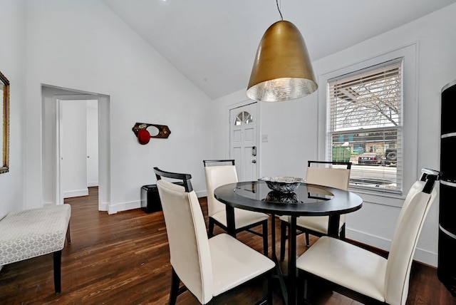 5313 Martin Ave, Austin, TX 78751 - dining room with dark wood finished floors, baseboards, and high vaulted ceiling