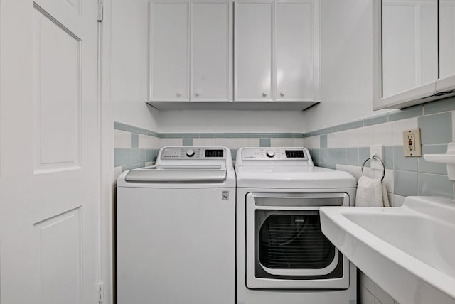 5313 Martin Ave, Austin, TX 78751 - laundry area with washing machine and dryer and cabinet space