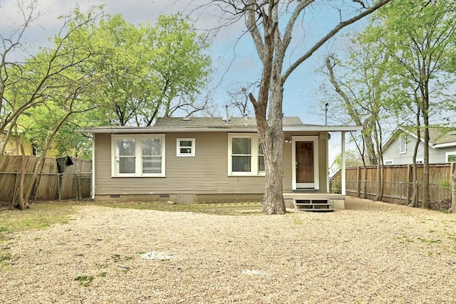 5313 Martin Ave, Austin, TX 78751 - back of house with crawl space and a fenced backyard