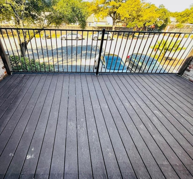 wooden terrace with a pool