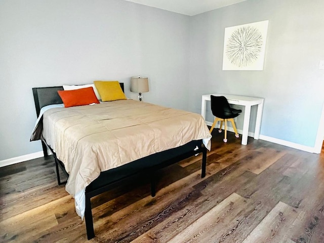 6501 E Hill Dr Unit 105, Austin, TX 78731 - bedroom with wood finished floors and baseboards