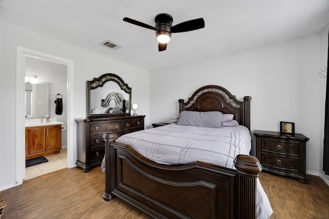 12404 Granton Cv, Austin, TX 78754 - bedroom featuring light wood-style floors, visible vents, ceiling fan, and connected bathroom