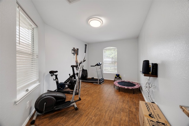 12404 Granton Cv, Austin, TX 78754 - workout area with baseboards, wood finished floors, and visible vents