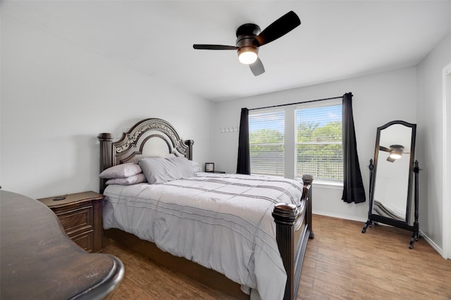 12404 Granton Cv, Austin, TX 78754 - bedroom with ceiling fan, baseboards, and light wood-style flooring