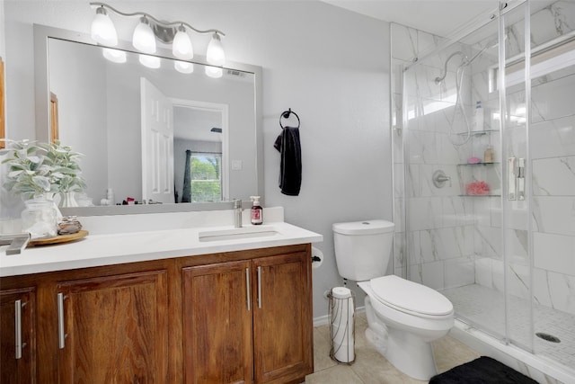 12404 Granton Cv, Austin, TX 78754 - bathroom with toilet, vanity, tile patterned floors, and a stall shower