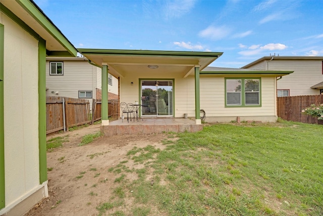 12404 Granton Cv, Austin, TX 78754 - rear view of property featuring a fenced backyard, a yard, and a patio