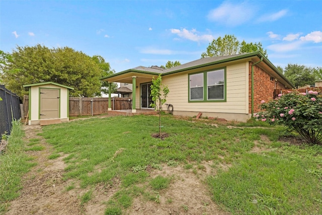 12404 Granton Cv, Austin, TX 78754 - back of property with a storage unit, a lawn, an outbuilding, and a fenced backyard
