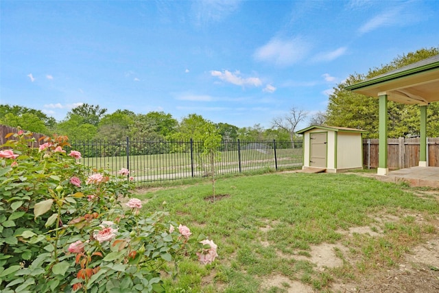 12404 Granton Cv, Austin, TX 78754 - view of yard featuring a fenced backyard, an outdoor structure, and a storage shed