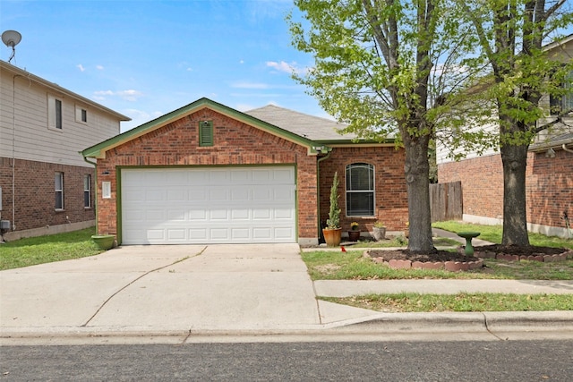 12404 Granton Cv, Austin, TX 78754 - ranch-style home featuring a garage, fence, brick siding, and concrete driveway