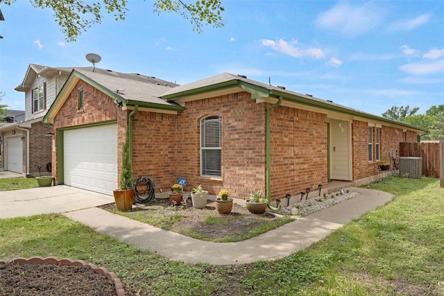 12404 Granton Cv, Austin, TX 78754 - ranch-style house featuring central air condition unit, concrete driveway, fence, a garage, and brick siding