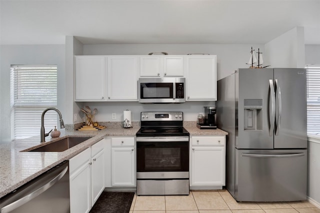 12404 Granton Cv, Austin, TX 78754 - kitchen featuring white cabinetry, stainless steel appliances, and a sink