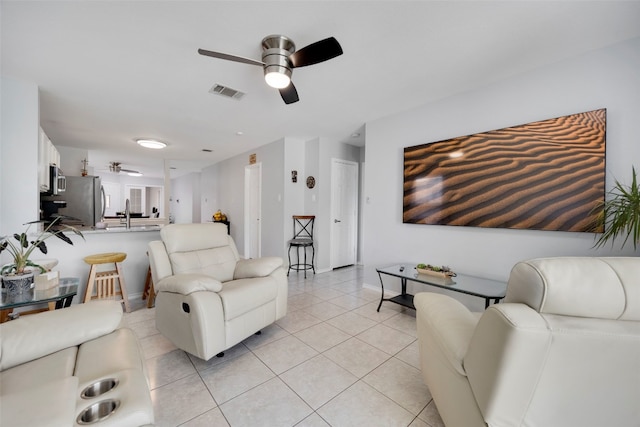 12404 Granton Cv, Austin, TX 78754 - living room featuring light tile patterned flooring, visible vents, baseboards, and ceiling fan