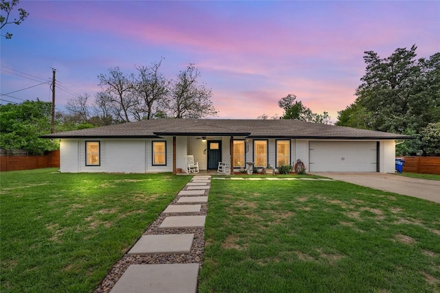 1241 Lake Terrace Dr, Elgin, TX 78621 - view of front of house with a porch, a garage, fence, concrete driveway, and a front lawn