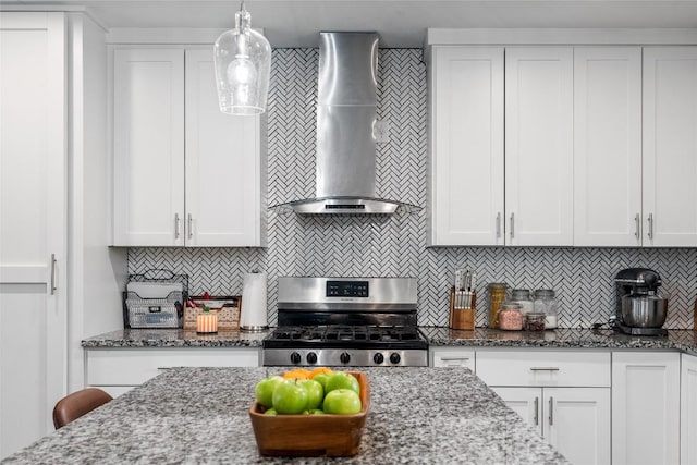 1241 Lake Terrace Dr, Elgin, TX 78621 - kitchen featuring backsplash, wall chimney range hood, white cabinetry, and stainless steel gas range oven