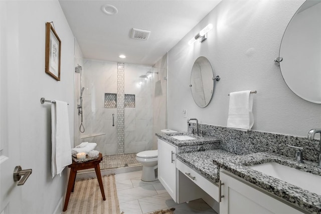 1241 Lake Terrace Dr, Elgin, TX 78621 - bathroom featuring toilet, a marble finish shower, a sink, and visible vents