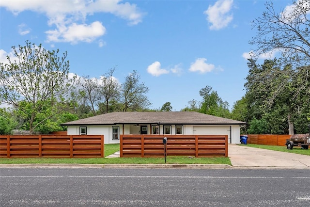 1241 Lake Terrace Dr, Elgin, TX 78621 - ranch-style house with an attached garage, a fenced front yard, and driveway