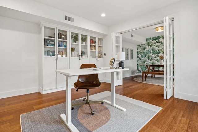 office area with baseboards, wood finished floors, and recessed lighting