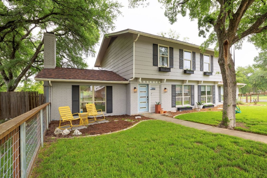 5702 Cherry Creek Dr, Austin, TX 78745 - view of front of property featuring a chimney and brick siding