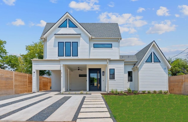 814 Stark St, Austin, TX 78756 - view of front of house featuring a carport, a shingled roof, a ceiling fan, and driveway