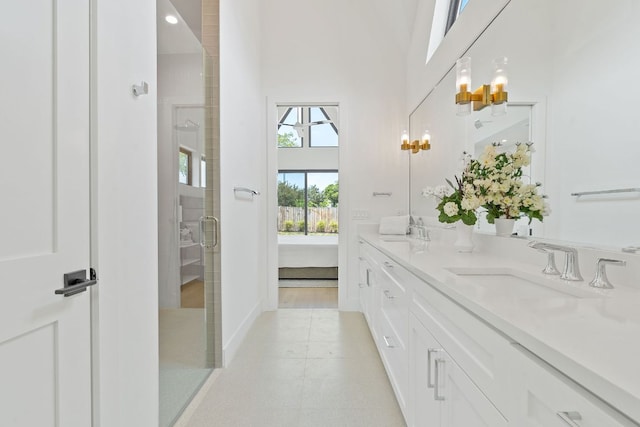 814 Stark St, Austin, TX 78756 - ensuite bathroom with double vanity, a towering ceiling, and a shower stall