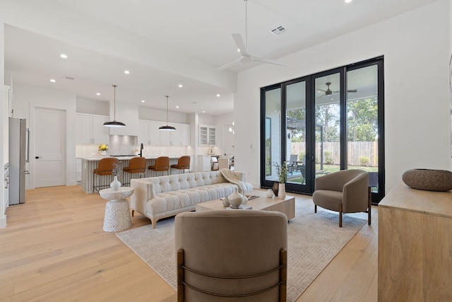 814 Stark St, Austin, TX 78756 - living area featuring a ceiling fan, light wood-style floors, and recessed lighting