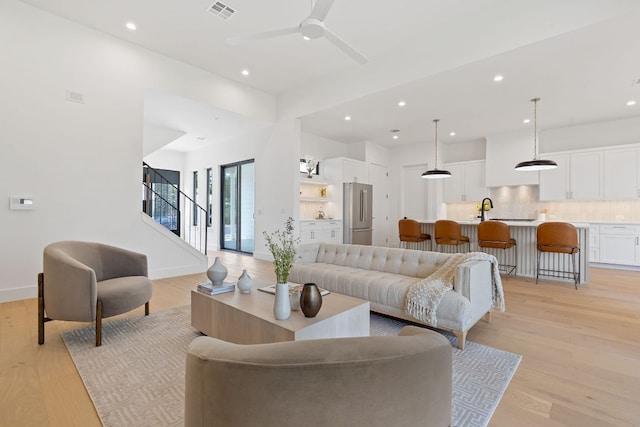 814 Stark St, Austin, TX 78756 - living room with recessed lighting, stairs, light wood-style floors, a ceiling fan, and baseboards