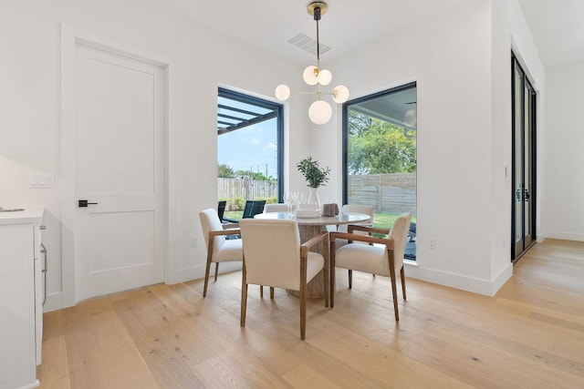 814 Stark St, Austin, TX 78756 - dining area with light wood-style floors and baseboards