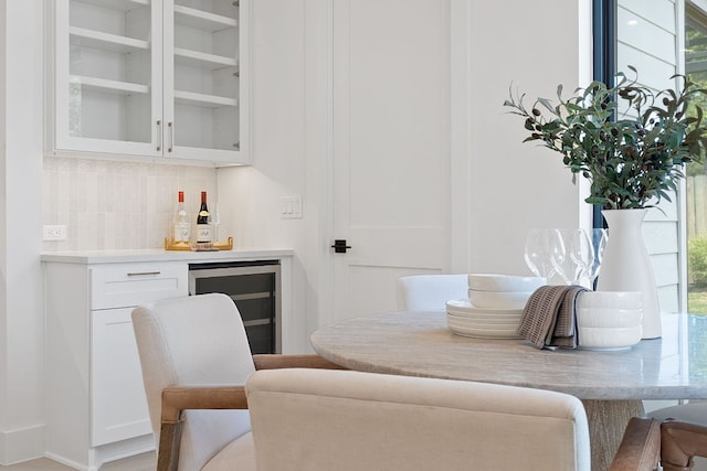 814 Stark St, Austin, TX 78756 - living area featuring wine cooler, a dry bar, and healthy amount of natural light
