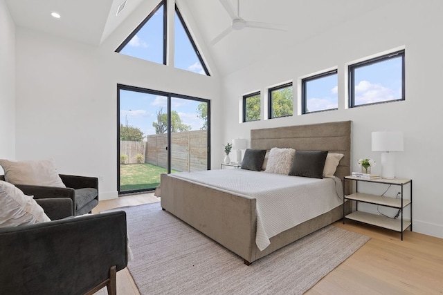 814 Stark St, Austin, TX 78756 - bedroom with access to outside, light wood finished floors, high vaulted ceiling, baseboards, and recessed lighting