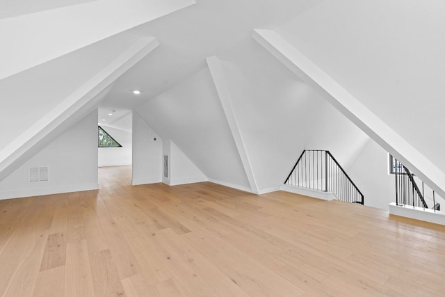 814 Stark St, Austin, TX 78756 - additional living space with lofted ceiling, light wood finished floors, and recessed lighting