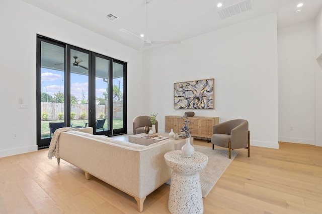 814 Stark St, Austin, TX 78756 - living room with light wood-style floors, baseboards, recessed lighting, and ceiling fan