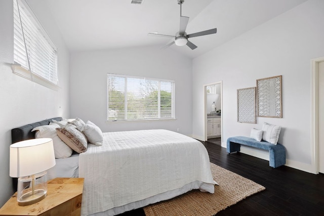 5901 Bolm Rd Unit H, Austin, TX 78721 - bedroom with vaulted ceiling, dark wood-style floors, baseboards, ceiling fan, and ensuite bathroom