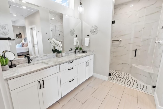 315 Southwind Rd, Point Venture, TX 78645 - ensuite bathroom with a marble finish shower and double vanity