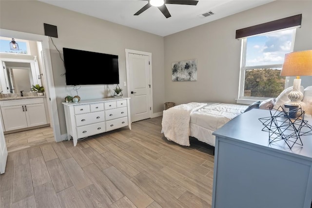 315 Southwind Rd, Point Venture, TX 78645 - bedroom with light wood-style floors and ceiling fan